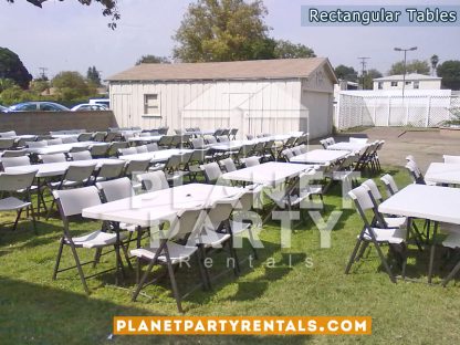 White plastic chairs with 6ft x 3ft rectangular tables