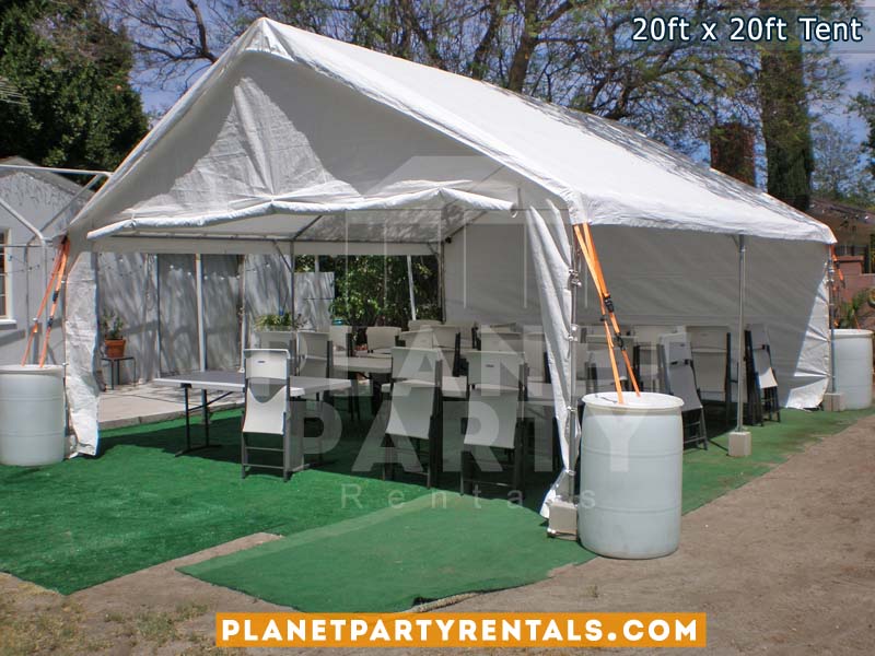 20x20 Tent with rectangular tables and white plastic chairs
