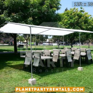 12ft x 20ft Tent with Rectangular Tables and White Plastic Chairs on Grass.