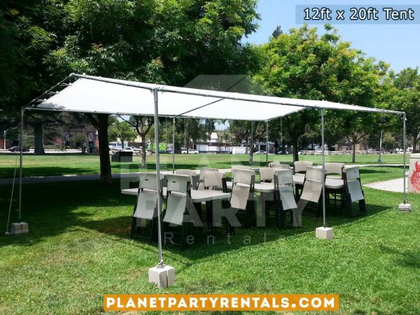 12ft x 20ft Tent with Rectangular Tables and White Plastic Chairs on Grass.